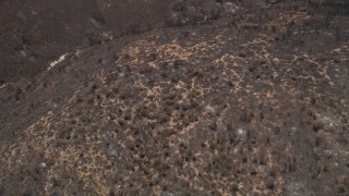 AX42_009 - 5K aerial stock footage bird's eye view of mountain slopes damaged by wildfire, Santa Monica Mountains, California