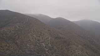 5K aerial stock footage of the Santa Monica Mountains with fog, California Aerial Stock Footage | AX42_056