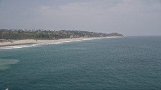 5K aerial stock footage fly over blue waters near the beach while approaching Point Dume, Malibu, California Aerial Stock Footage | AX42_083E