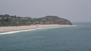 5K aerial stock footage flyby a beach by Point Dume in Malibu, California Aerial Stock Footage | AX42_085