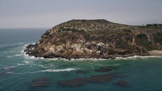 5K aerial stock footage of blue waters at the bottom of the cliffs of Point Dume, Malibu, California Aerial Stock Footage | AX42_089