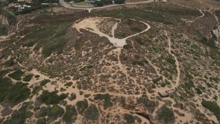 5K aerial stock footage tilt from the Pacific Ocean to reveal and approach Point Dume, Malibu, California Aerial Stock Footage | AX42_092