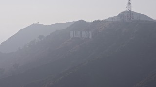 4K aerial stock footage flying by Hollywood Sign in fog, Los Angeles, California Aerial Stock Footage | AX43_005