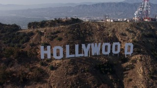 AX43_009 - 4K aerial stock footage approaching and flying by the world famous Hollywood Sign, Los Angeles, California