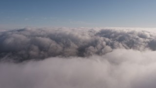 4K aerial stock footage flying above a thick marine layer over Los Angeles, California Aerial Stock Footage | AX43_049