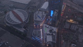 4K aerial stock footage of a wide shot of Staples Center and Nokia Theater, Downtown Los Angeles, twilight Aerial Stock Footage | AX44_046