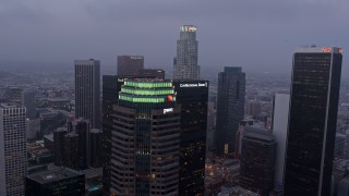 4K aerial stock footage flying by skyscrapers, Downtown Los Angeles, twilight Aerial Stock Footage | AX44_049