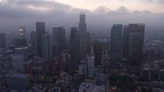 4K aerial stock footage of a marine layer hanging over skyscrapers, Downtown Los Angeles, twilight Aerial Stock Footage | AX44_051