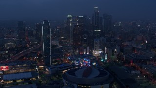 AX44_063 - 4K aerial stock footage approaching skyscrapers and high-rises, Downtown Los Angeles, twilight