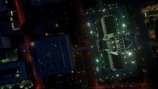 4K aerial stock footage approaching and tilting down on City Hall, Downtown Los Angeles, twilight Aerial Stock Footage | AX44_067