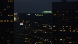 4K aerial stock footage of flying by skyscrapers with lights in the windows, Downtown Los Angeles, twilight Aerial Stock Footage | AX44_076E