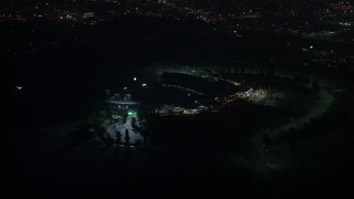 AX44_090 - 4K aerial stock footage orbiting Dodger Stadium, Los Angeles, California, night