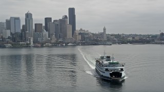 AX45_021E - 5K aerial stock footage tracking a ferry sailing away from Downtown Seattle skyline, Washington