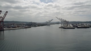 5K aerial stock footage flying by cargo cranes on Harbor Island, Seattle, Washington Aerial Stock Footage | AX45_036E