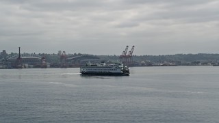 5K aerial stock footage orbiting ferry sailing Elliott Bay, revealing Downtown Seattle skyline, Space Needle in the background, Washington Aerial Stock Footage | AX45_047