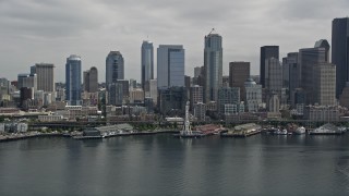 5K aerial stock footage approaching the Seattle Aquarium, Great Wheel and Downtown Seattle skyline, Washington Aerial Stock Footage | AX45_048