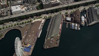 5K aerial stock footage tilting to bird's eye view of the Great Wheel, Pier 56, and Alaskan Way Viaduct in Downtown Seattle, Washington Aerial Stock Footage | AX45_050