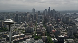 AX45_056E - 5K aerial stock footage flying by Space Needle to approach the Downtown Seattle skyline, Washington