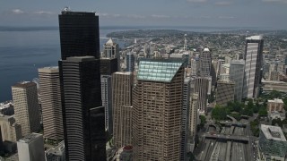 5K aerial stock footage flying over downtown buildings to approach the Space Needle, Downtown Seattle, Washington Aerial Stock Footage | AX45_066