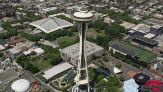 AX45_068 - 5K aerial stock footage approaching and tilting to a bird's eye of the Space Needle, Downtown Seattle, Washington