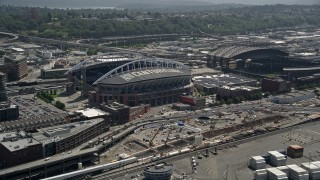 AX45_089E - 5K aerial stock footage approaching CenturyLink Field and Safeco Field, Downtown Seattle, Washington