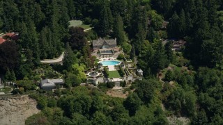 AX45_117 - 5K aerial stock footage flyby a mansion among trees, Shoreline, Washington