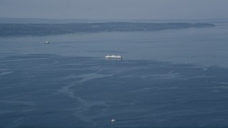 5K aerial  video flyby a ferry sailing on Puget Sound, Washington Aerial Stock Footage | AX45_119