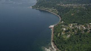 5K aerial stock footage follow train tracks toward Beach Camp at Sunset Bay, Edmonds, Washington Aerial Stock Footage | AX45_127