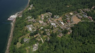 AX45_128 - 5K aerial stock footage approach mansions by Beach Camp at Sunset Bay, Edmonds, Washington