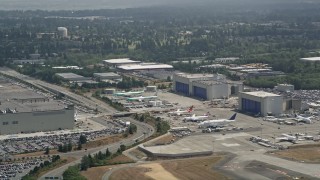 AX45_135 - 5K aerial stock footage of rows of airplanes by the Boeing Factory at Paine Field, Everett, Washington