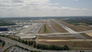 5K aerial stock footage of a view of a 747 airliner on the runway at Paine Field, Washington Aerial Stock Footage | AX45_146