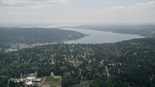 AX46_013 - 5K aerial stock footage approach suburban houses and Lake Washington, Brier, Washington