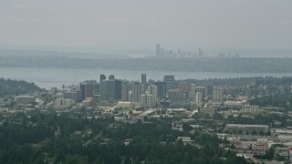 5K aerial stock footage of skyscrapers in Downtown Bellevue, Seattle skyline in the far distance, Washington Aerial Stock Footage | AX46_039