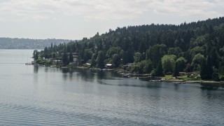 5K aerial stock footage of flying by lakeside homes with docks on Lake Washington, Mercer Island, Washington Aerial Stock Footage | AX46_047