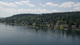 5K aerial stock footage of flying by lakeside homes with docks on the lake, Mercer Island, Washington Aerial Stock Footage | AX46_048