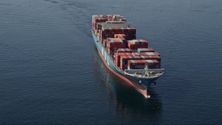 AX47_028 - 5K aerial stock footage of passing a cargo ship on Elliott Bay, Seattle, Washington