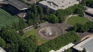 AX47_052 - 5K aerial stock footage of orbiting the Seattle Center Fountain; Downtown Seattle, Washington