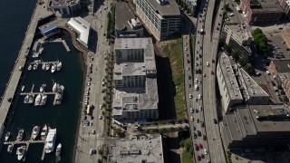 5K aerial stock footage of bird's eye of piers and apartment buildings on the Central Waterfront in Downtown Seattle, Washington Aerial Stock Footage | AX47_061