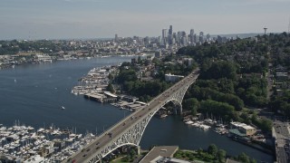 5K aerial stock footage fly over Aurora Bridge and Lake Union marinas to approach the Downtown Seattle skyline, Washington Aerial Stock Footage | AX47_073