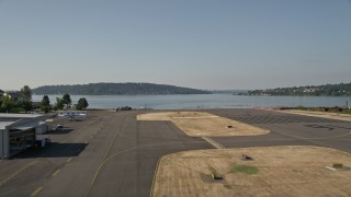 5K aerial stock footage lift off from Renton Municipal Airport and fly over Lake Washington, Seattle, Washington Aerial Stock Footage | AX48_001