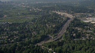 5K aerial stock footage of I-405 with traffic congestion beside a residential neighborhood, Bellevue, Washington Aerial Stock Footage | AX48_008