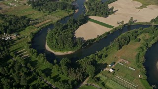 5K aerial stock footage tilt to a bird's eye view of the Snoqualmie River and farmland in Carnation, Washington Aerial Stock Footage | AX48_028