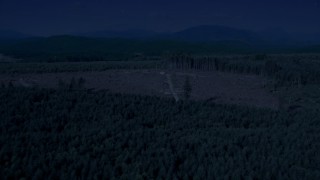 4K day for night color corrected aerial stock footage of a logging clear cut area in an evergreen forest, King County, Washington Aerial Stock Footage | AX48_048_DFN