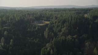 5K aerial stock footage of flying by large, upscale homes surrounded by forest, Carnation, Washington Aerial Stock Footage | AX49_013