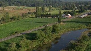 5K aerial stock footage of tracking a white van on a country road through farmland, Carnation, Washington Aerial Stock Footage | AX49_018