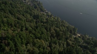 AX49_030E - 5K aerial stock footage fly over upscale homes, and tilt from lakeside homes for a wide view of Lake Sammamish, Washington