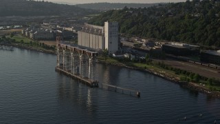 5K aerial stock footage flyby grain elevator on the shore of Elliott Bay in Seattle, Washington Aerial Stock Footage | AX49_088