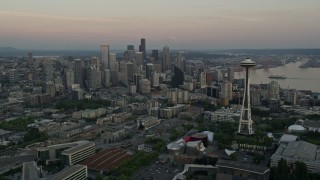 5K aerial stock footage of orbiting around the Seattle Space Needle to reveal skyscrapers in Downtown Seattle, Washington, sunset Aerial Stock Footage | AX50_033