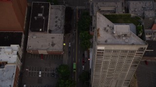 5K aerial stock footage of bird's eye view of following 1st Avenue through Downtown Seattle, Washington, sunset Aerial Stock Footage | AX50_056E