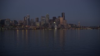 5K aerial stock footage of low approach to Downtown Seattle skyline at twilight, Washington Aerial Stock Footage | AX50_096E